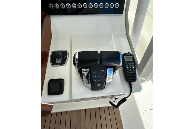  Yacht Photos Pics 2022 SeaVee 390Z boat controls with joystick, throttle, and communication device.