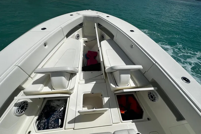  Yacht Photos Pics 2022 SeaVee 390Z boat interior with seating and storage compartments on the ocean.