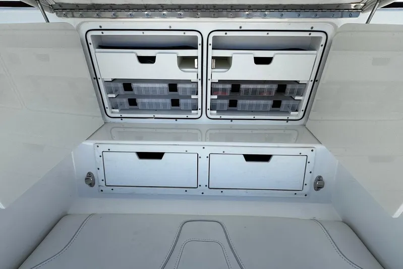  Yacht Photos Pics 2022 SeaVee 390Z boat storage compartments with organized tackle boxes and drawers.