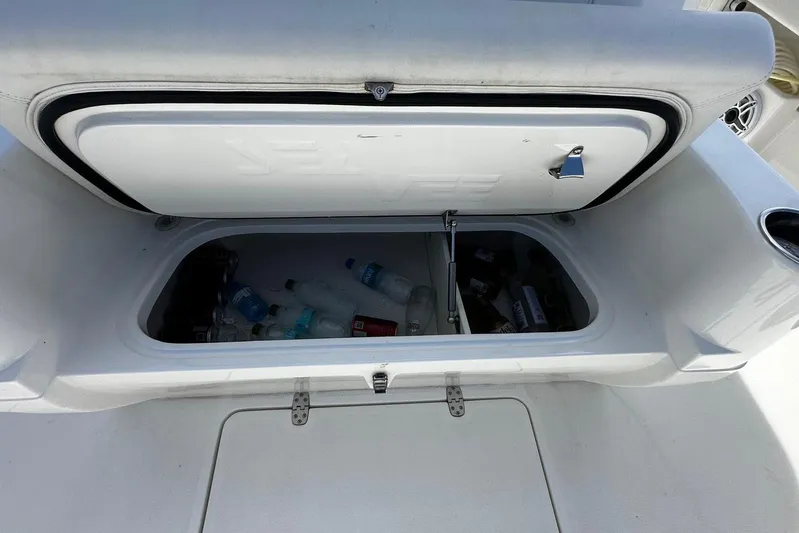  Yacht Photos Pics 2022 SeaVee 390Z boat storage compartment with bottles inside.
