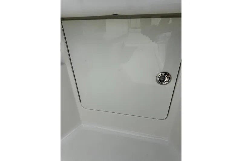  Yacht Photos Pics 2022 SeaVee 390Z boat compartment with sleek white finish and chrome handle.