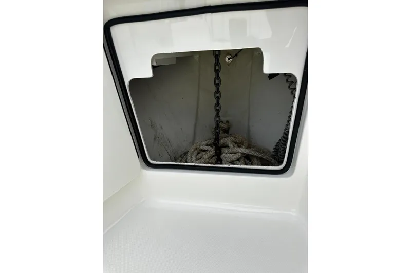  Yacht Photos Pics Anchor storage compartment on a 2022 SeaVee 390Z boat, featuring chain and rope.