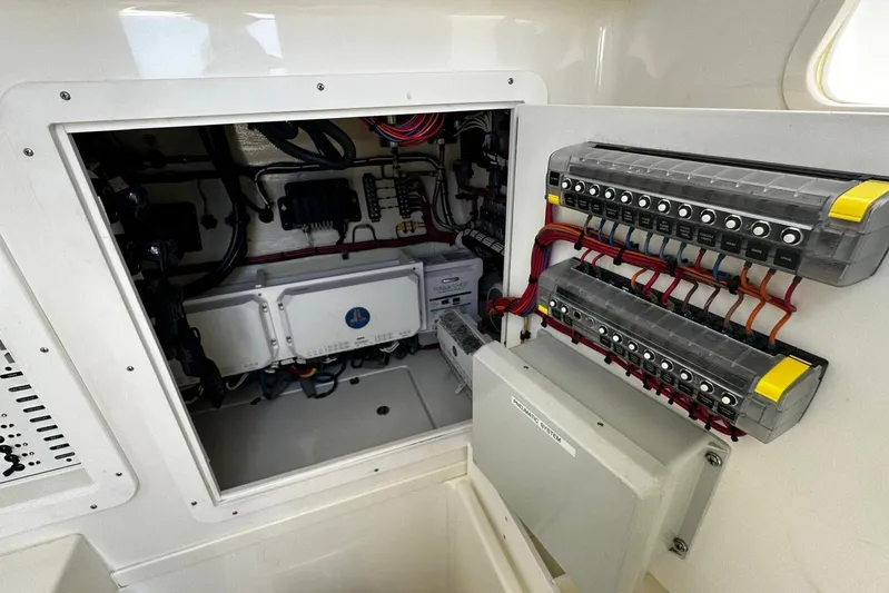  Yacht Photos Pics Electrical panel inside 2022 SeaVee 390Z boat, showcasing wiring and circuit components.