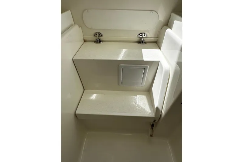  Yacht Photos Pics 2022 SeaVee 390Z interior detail showcasing storage compartment and seating area.