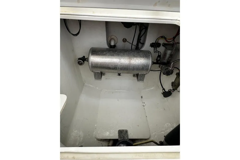  Yacht Photos Pics 2022 SeaVee 390Z boat compartment with metal tank and wiring.