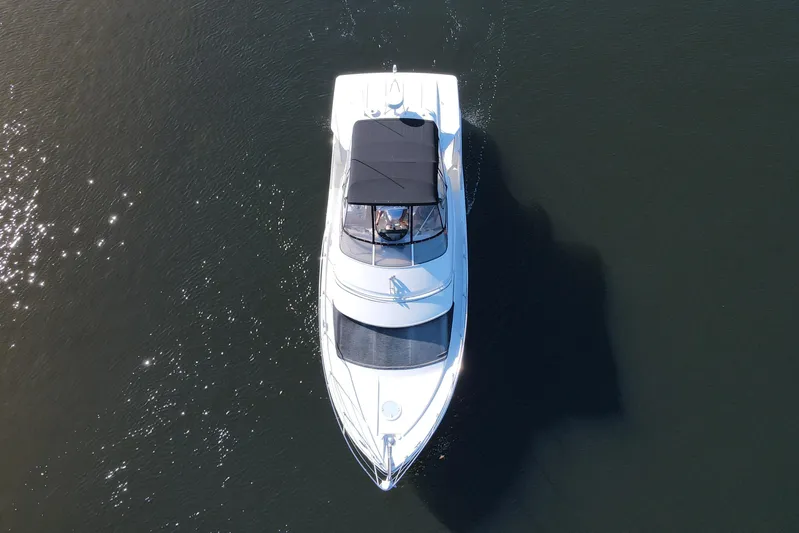Aloha Spirit Yacht Photos Pics Aerial view of 2005 Carver 41 Cockpit Motor Yacht on calm water.