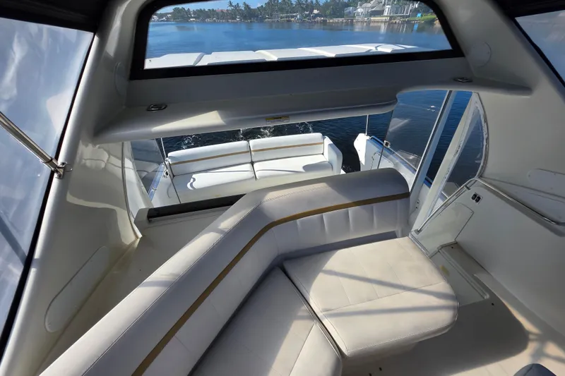 Aloha Spirit Yacht Photos Pics 2005 Carver 41 Cockpit Motor Yacht interior with white seating and scenic water view.