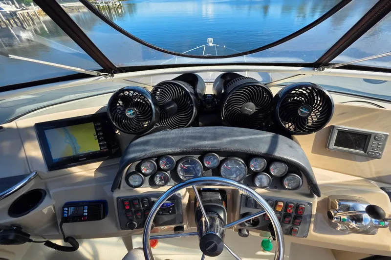Aloha Spirit Yacht Photos Pics 2005 Carver 41 Cockpit Motor Yacht helm with navigation screens and controls.