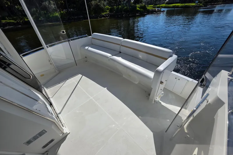 Aloha Spirit Yacht Photos Pics 2005 Carver 41 Cockpit Motor Yacht with spacious seating area by the water.