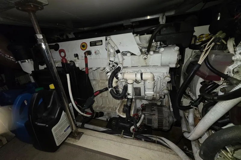Aloha Spirit Yacht Photos Pics Engine room of a 2005 Carver 41 Cockpit Motor Yacht, featuring Volvo Penta components.