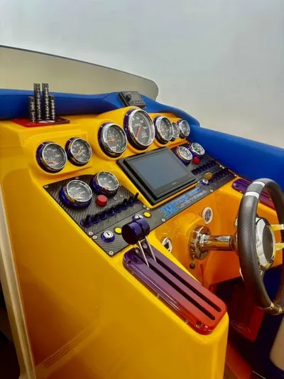 On Your Mark Yacht Photos Pics Dashboard of a 2005 Cigarette 39 Top Gun boat with vibrant gauges and controls.