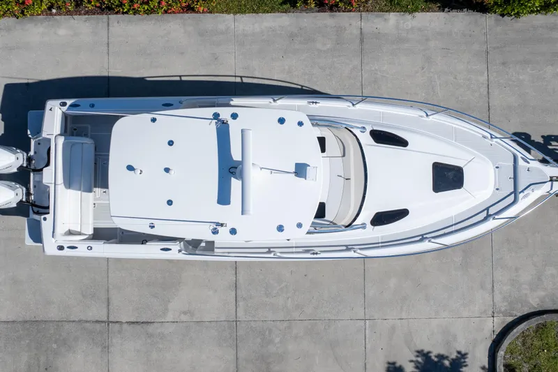  Yacht Photos Pics Aerial view of 2007 Intrepid 350 WA boat on concrete surface.