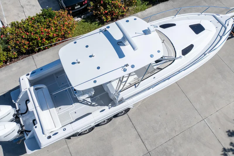  Yacht Photos Pics Aerial view of 2007 Intrepid 350 WA boat docked on concrete surface.