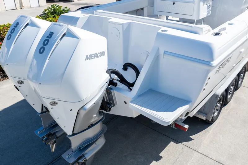  Yacht Photos Pics 2007 Intrepid 350 WA boat with twin Mercury 300 engines, docked on a trailer.