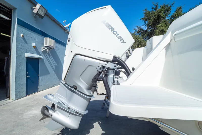  Yacht Photos Pics 2007 Intrepid 350 WA boat with Mercury outboard motor in a sunny outdoor setting.