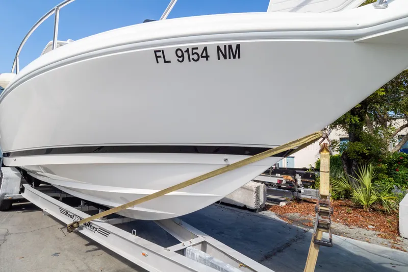  Yacht Photos Pics 2007 Intrepid 350 WA boat on trailer, secured with straps, side view.