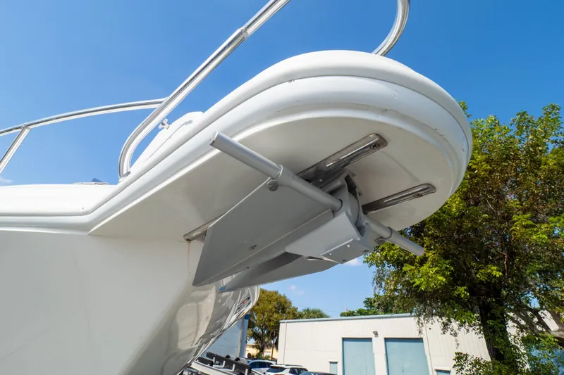  Yacht Photos Pics 2007 Intrepid 350 WA boat detail with trim tabs, clear sky background.