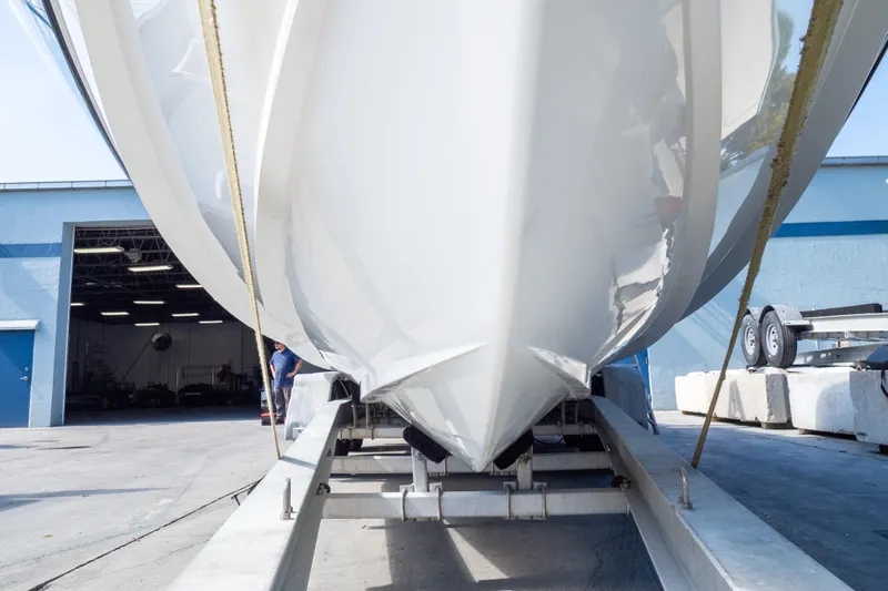  Yacht Photos Pics 2007 Intrepid 350 WA boat on trailer outside a blue building.