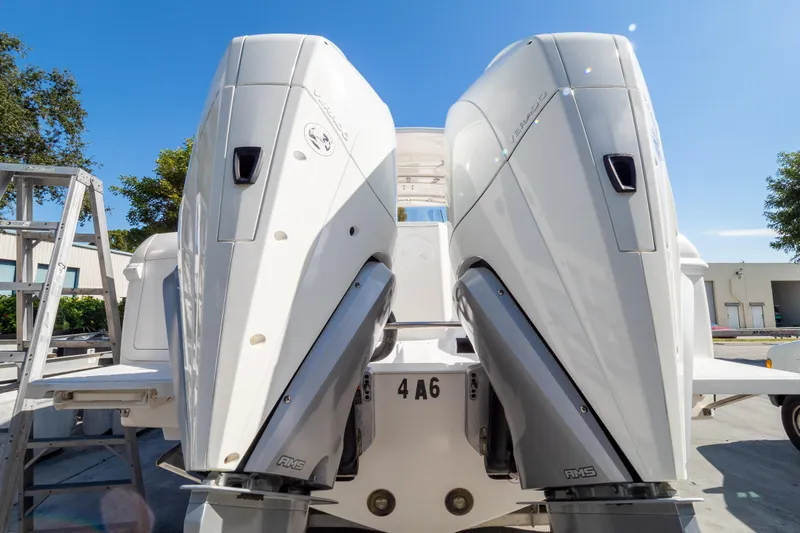  Yacht Photos Pics 2007 Intrepid 350 WA boat with dual outboard engines in a sunny outdoor setting.