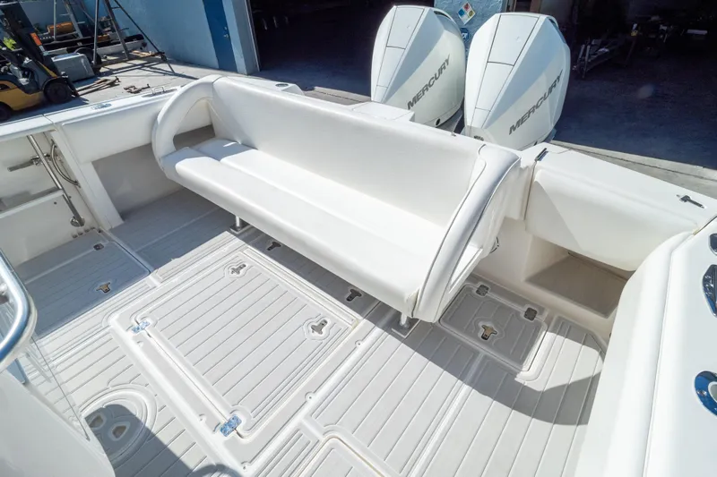  Yacht Photos Pics 2007 Intrepid 350 WA boat interior with white seating and dual Mercury engines.