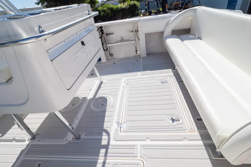  Yacht Photos Pics 2007 Intrepid 350 WA boat interior with white seating and deck.