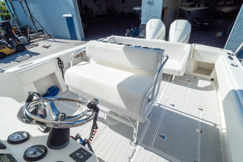  Yacht Photos Pics 2007 Intrepid 350 WA boat interior with steering wheel and seating area.