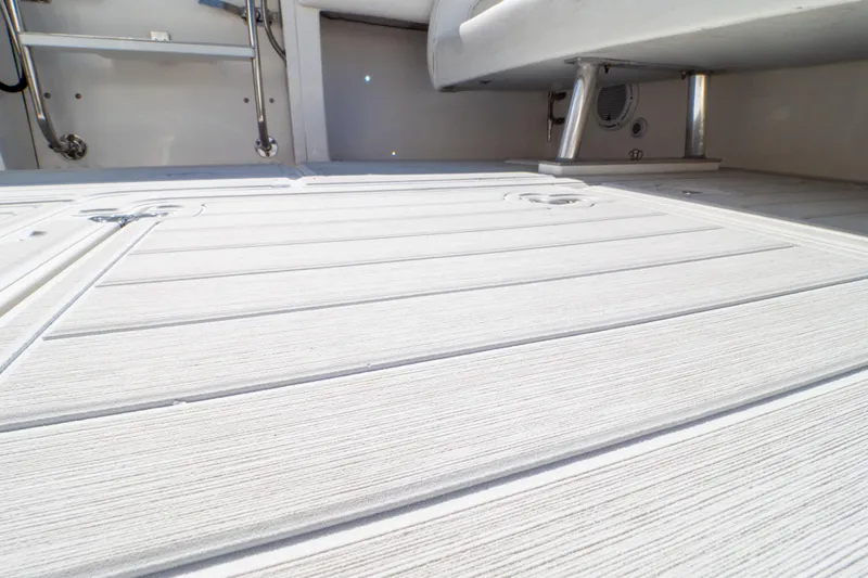  Yacht Photos Pics 2007 Intrepid 350 WA boat deck with sleek, textured flooring and metal fixtures.