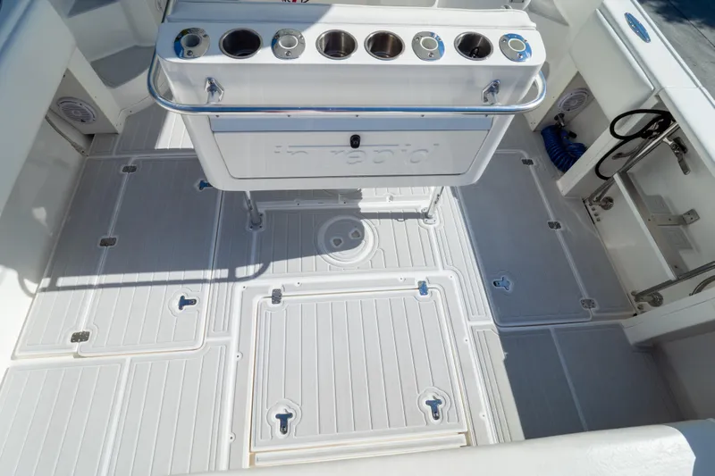 Yacht Photos Pics 2007 Intrepid 350 WA boat deck with storage compartments and rod holders.