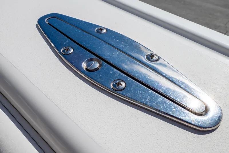  Yacht Photos Pics Close-up of a 2007 Intrepid 350 WA boat's polished metal cleat on deck.