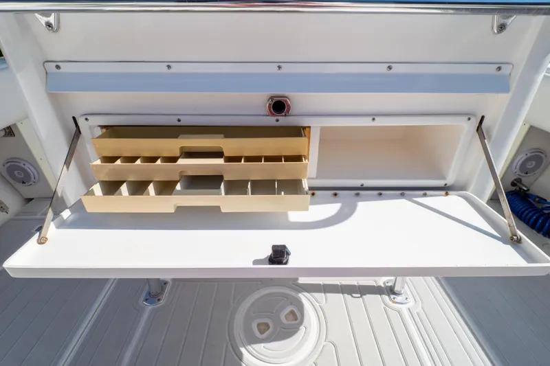  Yacht Photos Pics Open storage compartment with shelves on a 2007 Intrepid 350 WA boat.