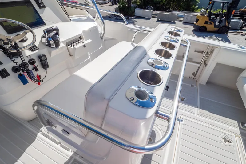  Yacht Photos Pics 2007 Intrepid 350 WA boat cockpit with control panel and rod holders.