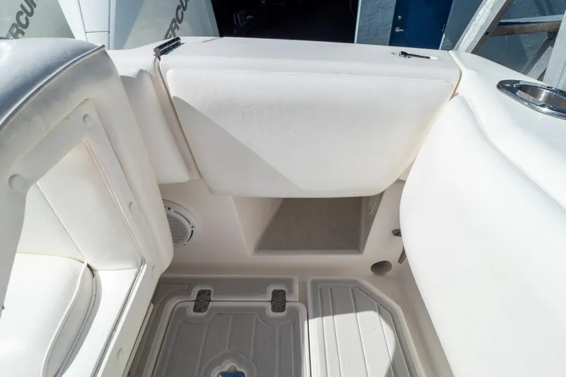  Yacht Photos Pics 2007 Intrepid 350 WA boat interior with white seating and storage compartments.