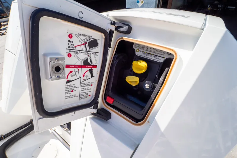  Yacht Photos Pics Open engine compartment of 2007 Intrepid 350 WA boat, showing instructions and yellow controls.