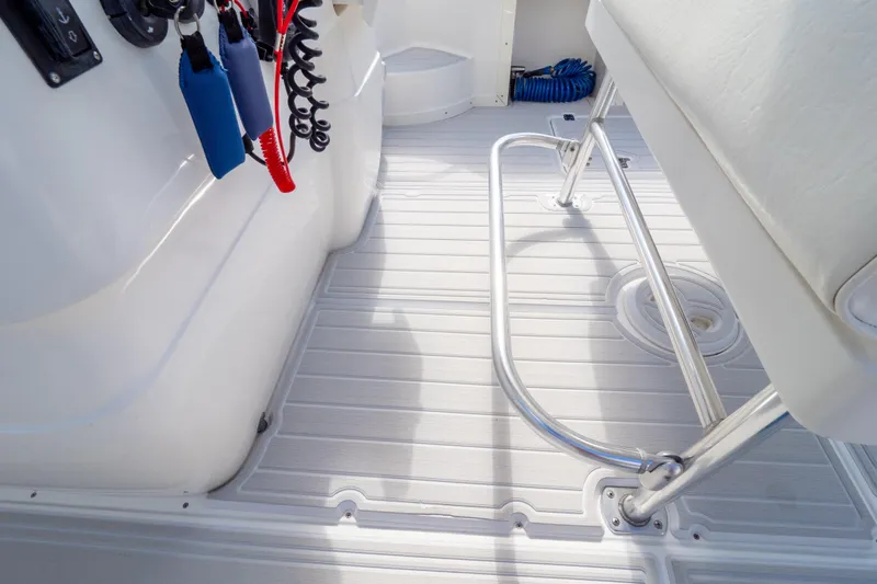  Yacht Photos Pics 2007 Intrepid 350 WA boat interior with white deck and metal railing.