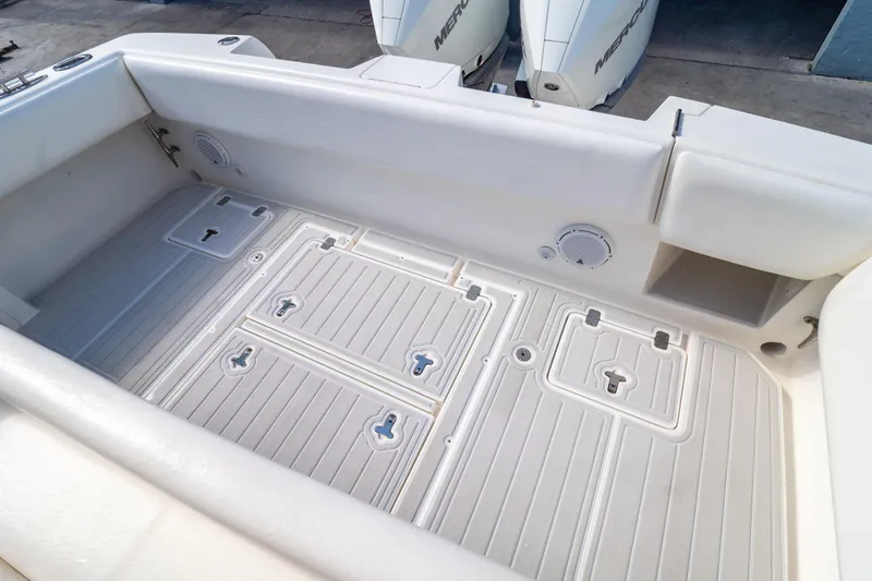  Yacht Photos Pics 2007 Intrepid 350 WA boat deck with storage compartments and clean white finish.