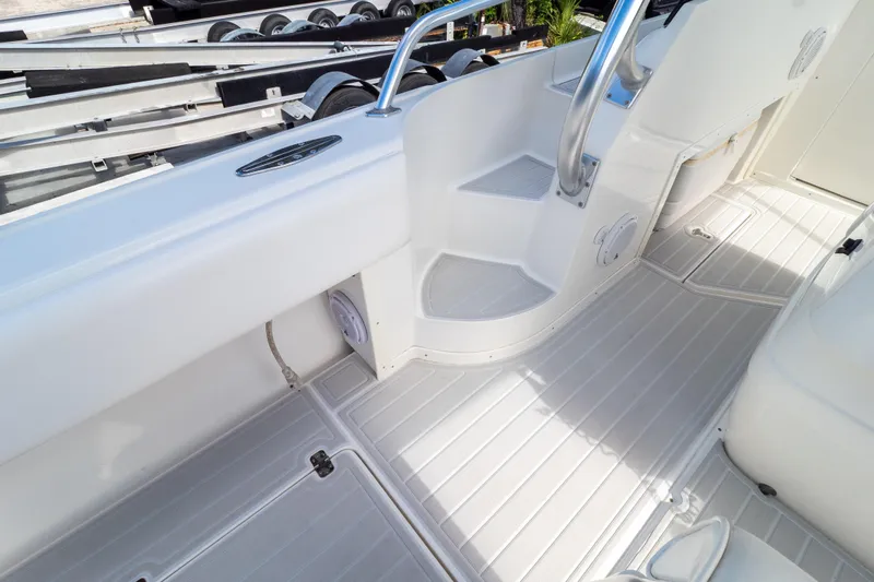  Yacht Photos Pics 2007 Intrepid 350 WA boat interior with white deck and seating area.