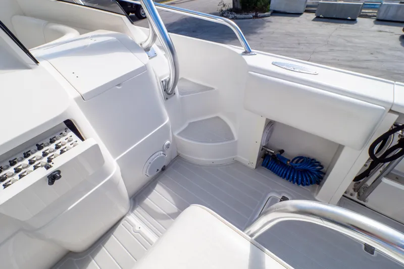  Yacht Photos Pics 2007 Intrepid 350 WA boat interior with white seating and storage compartments.