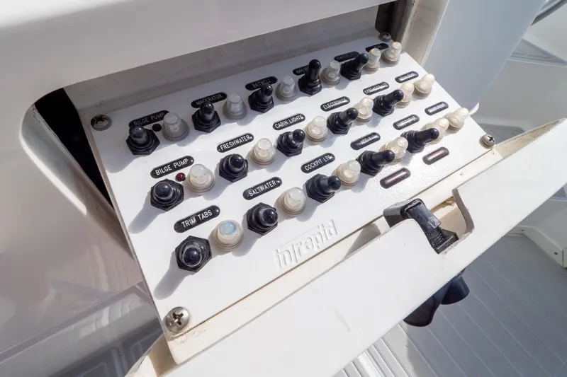  Yacht Photos Pics Control panel of a 2007 Intrepid 350 WA boat with labeled switches.