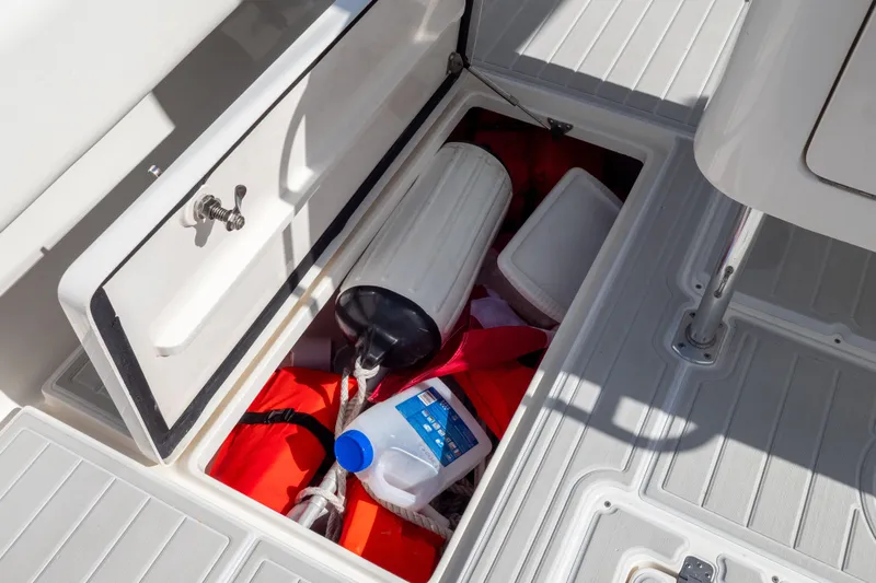  Yacht Photos Pics Storage compartment on a 2007 Intrepid 350 WA boat with safety gear and supplies.