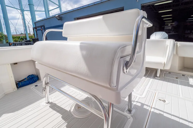  Yacht Photos Pics White seating on 2007 Intrepid 350 WA boat deck, featuring stainless steel railings.