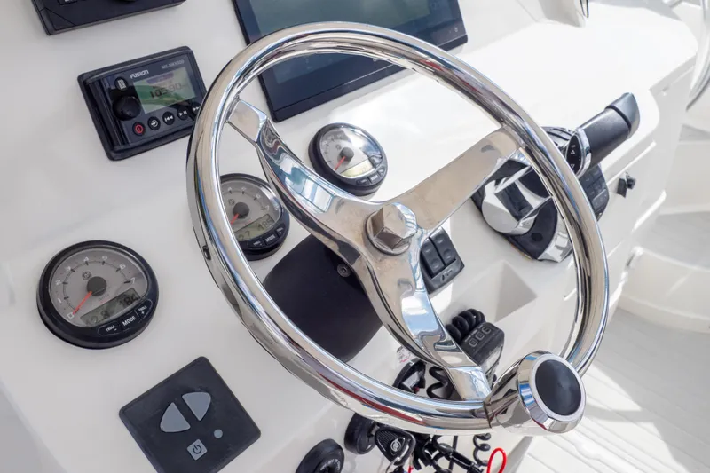  Yacht Photos Pics Steering wheel and dashboard of 2007 Intrepid 350 WA boat.