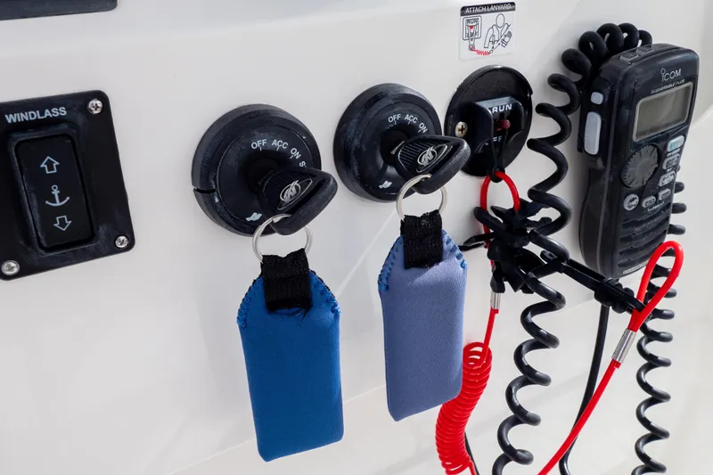  Yacht Photos Pics Control panel of a 2007 Intrepid 350 WA boat with keys and radio.