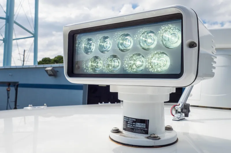  Yacht Photos Pics LED spotlight on 2007 Intrepid 350 WA boat, mounted on deck, under cloudy sky.