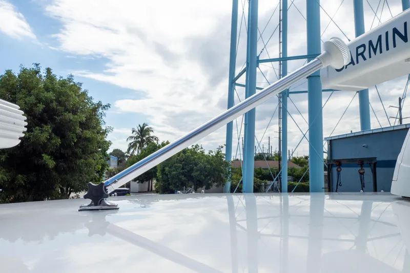  Yacht Photos Pics Antenna on 2007 Intrepid 350 WA boat with clear sky and trees in background.