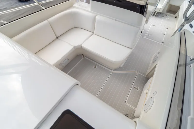  Yacht Photos Pics 2007 Intrepid 350 WA boat interior with white seating and sleek flooring.