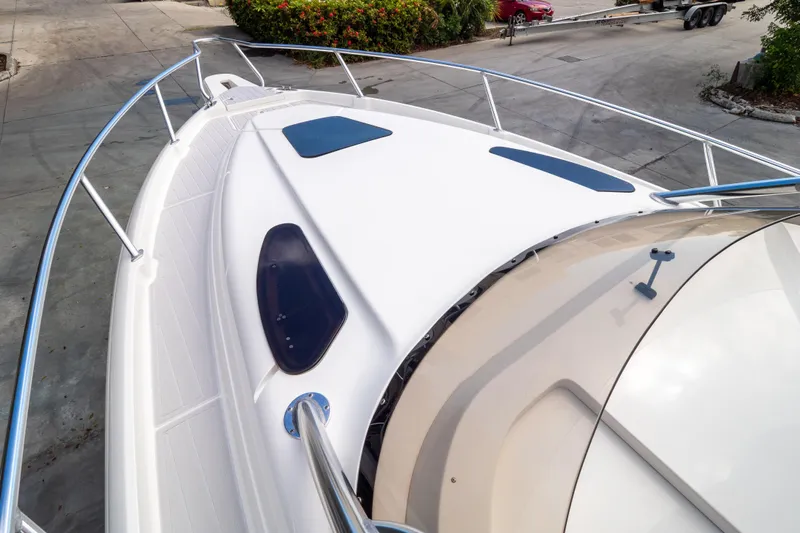  Yacht Photos Pics 2007 Intrepid 350 WA boat deck with sleek design and stainless steel railings.