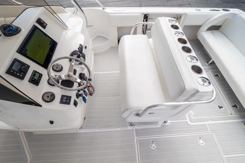  Yacht Photos Pics 2007 Intrepid 350 WA boat interior with steering console and seating area.