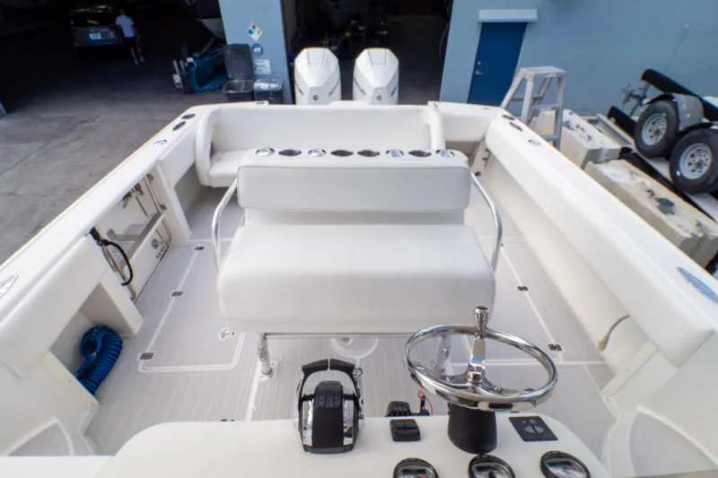  Yacht Photos Pics 2007 Intrepid 350 WA boat cockpit with steering wheel and seating area.