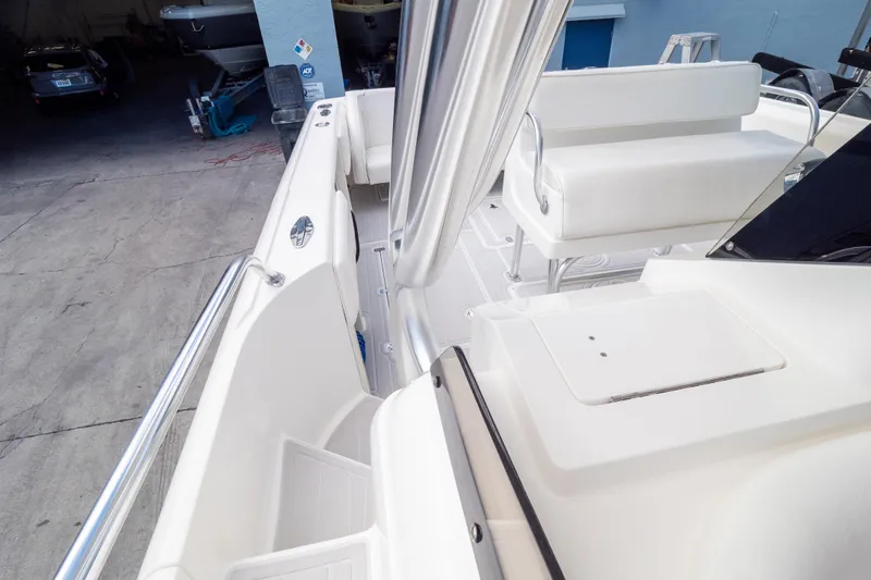  Yacht Photos Pics 2007 Intrepid 350 WA boat interior with white seating and storage compartments.