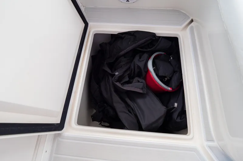  Yacht Photos Pics Storage compartment on 2007 Intrepid 350 WA boat with black gear and red item.